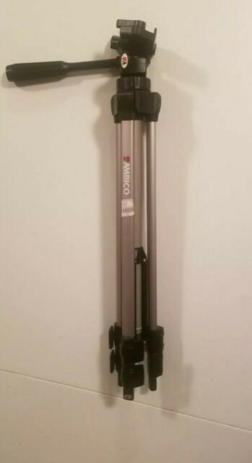 A Mini Projector And Tripod Stand