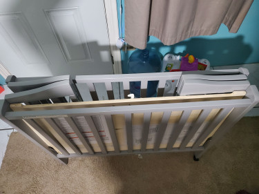 Portable Crib With Mesh Liner.