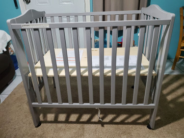 Portable Crib With Mesh Liner.