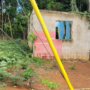 Half Acre With Unfinished Structure