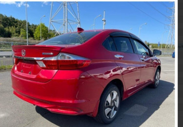 RED 2016 HONDA GRACE FOR SALE